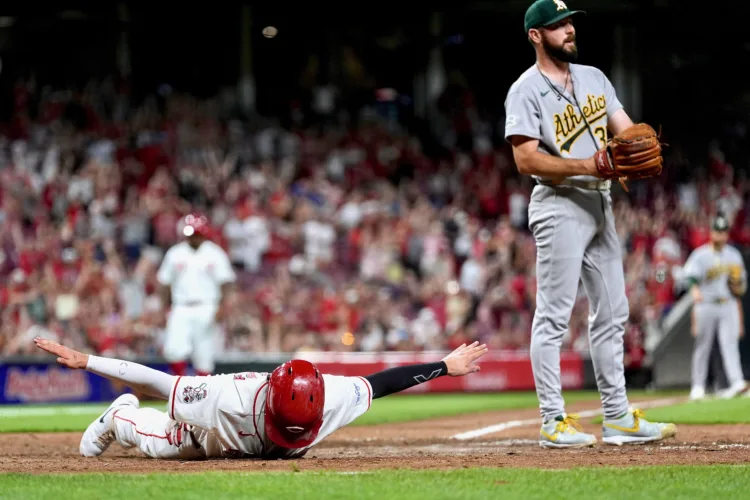 Reds scores twice in 8th to beat Athletics